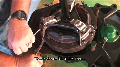 At the end of the stroke a. . How to adjust steering clutches on john deere 450